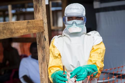Kailahun. Sierra Leone. Médecins Sans Frontières (MSF) Ebola Treatment Centre. A nurse enters the high-risk area after getting dressed with protective clothing.