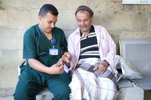 Abdul Jalil works in breaking stones, and gunpowder exploded on his hand.. After undergoing surgery on his hand, Dr. Ahmed who works as therapist for MSF provide physiotherapy treatment for Abdul Jalil's hand so that he can move it again.