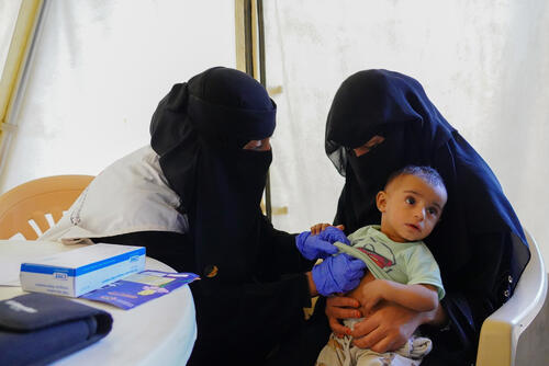 MSF doctor Asma examines baby Aliya at Al-Noor mobile clinic in Marib, Yemen. The eight-month-old is diagnosed with moderate acute malnutrition.