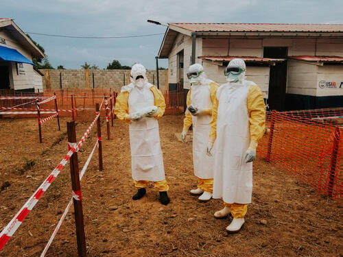 Dr Papy Dieya, MSF doctor, and two staff of the Congolese Ministry of Health at the Wangata Ebola Treatment Centre, Mbandaka, DRC.