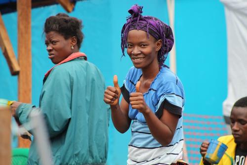 Deddeh has recovered from Ebola and celebrates her joy. Out of solidarity she decides to stay in the Ebola confirmed area to take care of Elijah, a young boy (3 months) who has lost his mother to Ebola and has been infected himself.