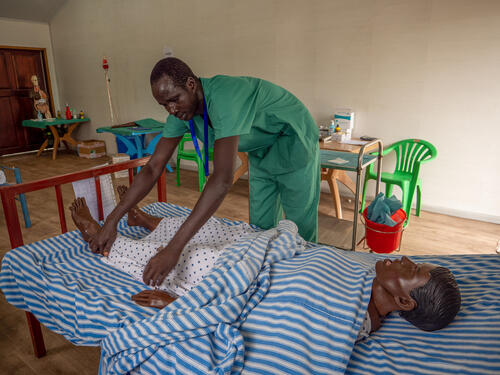 Gabriel Kalany, MSF Academy student in Old Fangak, has finished placing a urinary catheter on a female mannequin and covers the patient with a bed sheet. After 18 months of training, Gabriel graduated from the MSF Academy in Old Fangak in June 2022.