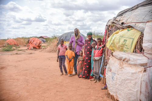50-year-old Borow Ali Khamis stands outside their makeshift shelter with his family at the Dagahaley refugee camp. He was a farmer and livestock keeper in Somalia, but has lost everything  due to the long drought. 
 
“I left Somalia because of the drought after I lost everything. My journey here and my stay now has been fully dependent on people’s kindness. I came with one of my two wives and six children. I left one wife in Somalia as she had younger children as I couldn’t gamble with my whole family.” Borow Ali explains.
