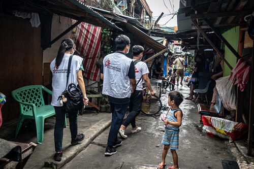 The MSF patient support team navigates overcrowded and narrow alleys of Barangay 105 Aroma neighbourhood, Barangay 105, of Tondo, Manila, the Philippines, March 2, 2023.