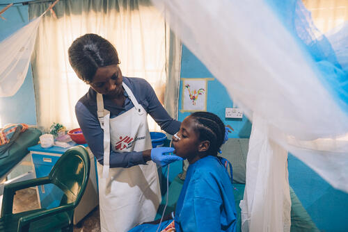 Mosoaya Harrison Karrau, MSF Physiotherapist, does exercises with Fatima, a 20-year-old noma survivor who had trismus caused by noma. Trismus is a medical condition that noma can caused and that blocks the jaws. May 5, 2023.