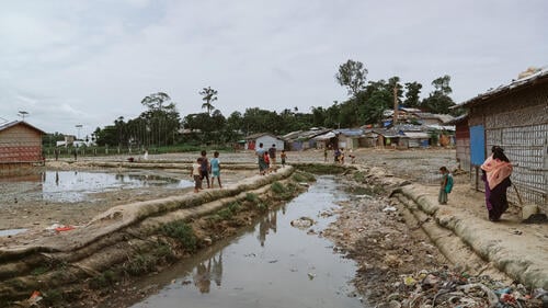 Children walking through the outskirts of the camps.