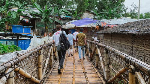 MSF staff walking through the Bangladesh refugee camps.