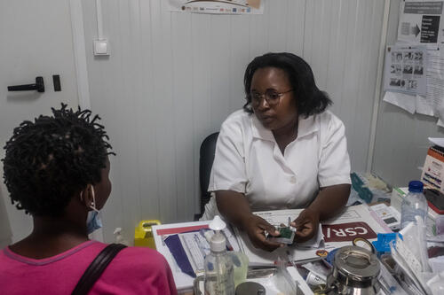  Cintia, a nurse and head of maternity and safe abortion services at Munhava Health Center in Beira, Mozambique, speaks with a patient. Before she began supporting safe abortion care, she said, "I didn't agree with it because of religion, community, myths in general. But seeing that many people were dying because of abortion, to prevent maternal deaths I eventually accepted it. I do safe abortions without any prejudice. [My friends and family] still think it is a sin. Even for me, they say that I will not go to heaven. Others say, 'do you still receive communion in church?' Every now and then I get down, but then I think of the patient, and that’s it!"