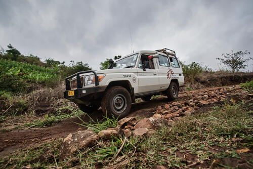 Phole Khoromana, MSF health promotion officer, during mobilization activities. The MSF team drives along rural roads to tell women in the surrounding villages to come to MSF health talks. The team works in rural communities where the nearest health center is more than 5 km away.