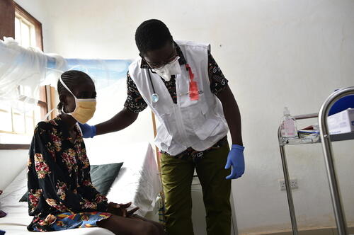 24-year-old Zainab Kamara attending a medical consultation provided by MSF Clinical Officer, Dominic Pessima, at the MSF Supported drug-resistant tuberculosis ward in Makeni Regional Hospital, Bombali Districts, Sierra Leone. 
Zainab Kamara is from Makeni. She has been diagnosed with multidrug-resistant tuberculosis (MDR-TB) and started her 18 months all oral treatment in May 2023. She has a history of previously interrupted treatment due to lack of family support and has now been placed on an individualized drug regimen to adequately address the type of resistance she is facing.