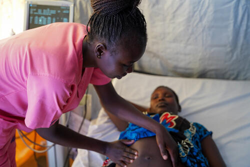 Guo Beatrice Cosmas, MSF midwife supervisor, checks on Ita Joice and her baby ahead of her caesarean section in Mundari County Hospital, the only secondary healthcare facility in Kajo Keji, Central Equatoria.