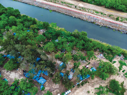 Aerial view of the migrant camp at the edge of the Rio Bravo that separates Matamoros, Tamaulipas, from Brownsville, Texas.