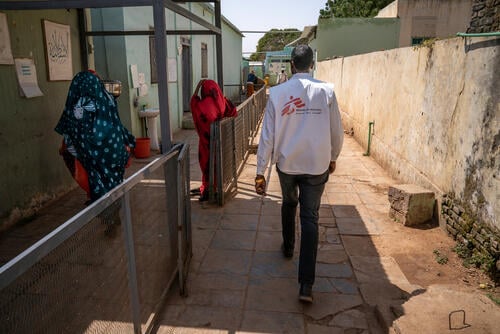 A MSF doctor walks through the courtyard of El Geneina Teaching Hospital, the only referral hospital in all of West Darfur, Sudan. February 19, 2024. Copyright Diana Zeyneb Alhindawi