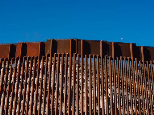 A view of the border wall and Mexico beyond.