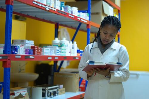 Dr. Elizabeth Muritu takes stock of medicines in the Karuri medically assisted therapy (MAT) clinic in Kiambu.