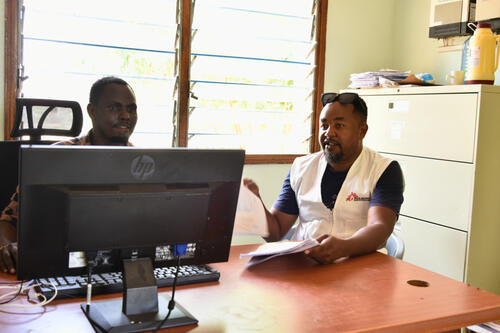 MSF clinician Kenneth Mwangi(right) analyses patient data with Marsabit county health records person at Laisamis sub-county hospital Jameson Ledany as part of on job training.