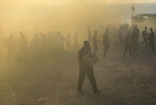 Palestinians at the GHF distribution site in Netzarim putting their lives at risk to receive some food.

The Gaza Humanitarian Foundation (GHF). All four distribution sites operated by the GHF are located in areas under full Israeli military control and “secured” by private American armed contractors.

Between 7 June and 24  July 2025, MSF health centres in close proximity received 1,380  injured people, including 28 dead bodies from the GHF sites with 174 gunshot wounded.

MSF calls for an immediate cessation of the GHF distribution mechanism and urges states and private donors to refrain from funding what is essentially a death trap.