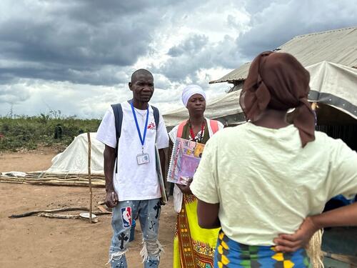 MSF Health Promoters Jorge Francisco Matias and Sinae Mussa talk to a woman during a home visit in Lianda displacement camp, Mueda District. MSF team of Health Promoters visit regularly this and other shelters to follow up on the health status of identified patients and, if needed, refer them to the nearest health centre or hospital.