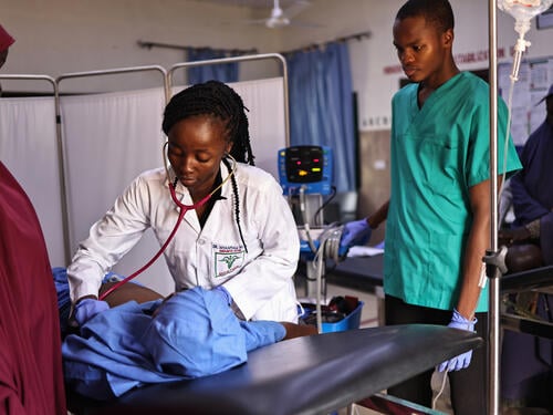 MoH doctor working with MSF, Nyantau Mancit Samuel examines a female patient at the resuscitation area of the MSF supported Accident and Emergency unit at Gwoza General Hospital, Gwoza local government area of Borno state, northeast Nigeria.