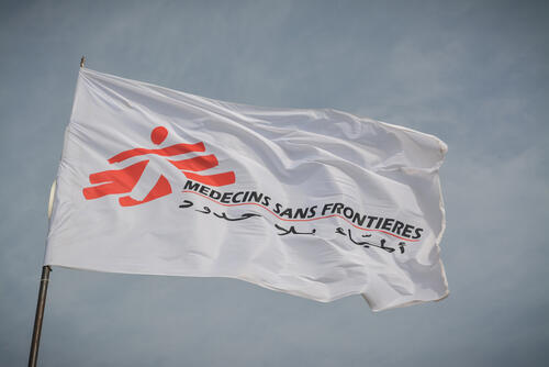 The MSF flag flutters in the wind at MSF’s clinic in Al-Tanideba camp for Tigray refugees, in Eastern Sudan.