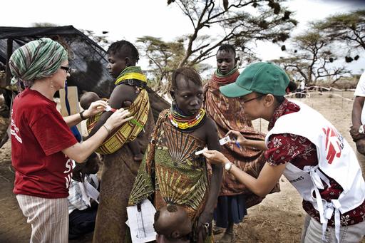 Doctors without Borders staff handles a food distribution on behalf of WFP, and conduct an ambulatory therpeutic feeding program for severely malnourished children in several villages in Turkana, Kenya, August 17, 2011. The Horn of Africa is suffering one of the worst droughts in years, displacing thousands, and killing others through severe malnutrition.     Severely malnourished children are treated in the government hospital and monitored by MSF staff in Lokituan, Turkana.