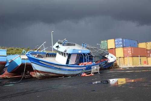 Boats are left at the landing port of Pozzallo in Sicily. These boats have been used to carry migrants, asylum seekers and refugees to reach Italy through the Mediterranean Sea.