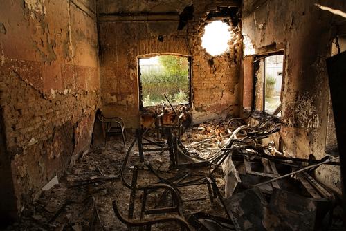 An interior view of the MSF Trauma Centre, 14 October 2015, shows a missile hole in the wall and the burnt-out remians of the the building aftera sustained attack on the facility in Kunduz, northern Afghanistan..