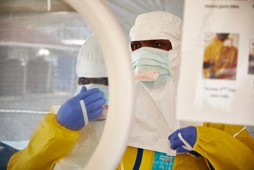 Medical workers put on PPE gear in the changing station at the Nongo Ebola Treatment Clinic in Conakry, Guinea on November 27, 2015. 

The clinic is treating the last known Ebola patient in Guinea. A month old baby named Nubia, whose mother died after giving birth on October 27th.