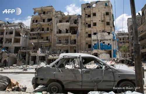 A picture taken on April 28, 2016 shows a general view of the damaged Al-Quds hospital  building (R) following reported airstrikes on the rebel-held neighbourhood of Sukkari in the northern city of Aleppo.
Doctors Without Borders condemned Thursday the "outrageous" air strike on a hospital it was supporting in the war-torn northern Syrian city of Aleppo, where doctors were among those killed. Local rescue workers said the overnight strike on the Al-Quds hospital  and a nearby residential building left 30 people dead. Among them was the only paediatrician operating in the rebel-controlled eastern parts of Aleppo city, they said. Doctors Without Borders, which is also known by the acronym MSF, said two doctors were among 14 people killed in the strike on the hospital. In an online statement Thursday, Doctors Without Borders (MSF) said it had been donating medical supplies to Al-Quds since 2012. MSF said it had been donating medical supplies since 2012 to the 34-bed Al-Quds hospital, where eight doctors and 28 nurses worked full time. Karam Al-Masri/AFP