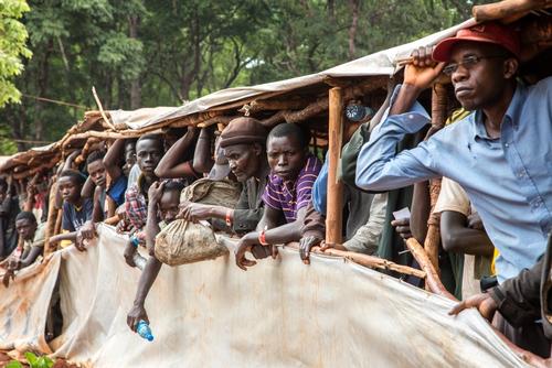 More than 300 people arrive each day in Nduta camp, originally designed for 50,000 people but now hosting over 65,000. New arrivals come by bus, first crossing the border point, then to transit camps and and then staying a few nights in the camp reception centre on arrival to Nduta. While they are being registered by UNHCR and before a family shelter is allocated to them, they live in overcrowded communal tents, facing poor hygiene and a high risk of malaria transmission.
New arrivals have to queue for hours in the reception centre to receive their daily meals. Some of these people have already been allocated a shelter, but have not received their refugee card and dry food rations. They have to come back every day to the reception centre to get a warm meal.
MSF is present at the reception centre to screen all new arrivals. “A lot of them arrive exhausted and in bad health condition. We do their medical check-up and send those in need to MSF clinics or refer them to the hospital. They also get vaccinated and pregnant women are scheduled for antenatal consultations.”
Medical teams have seen a big increase in the number of consultations, both at the reception centres and in MSF’s four health posts and hospital. The number of deliveries has risen as well. “When I arrived a few weeks ago, there were around five deliveries per day. Now we have around 12,” says Sally Parker, midwife.