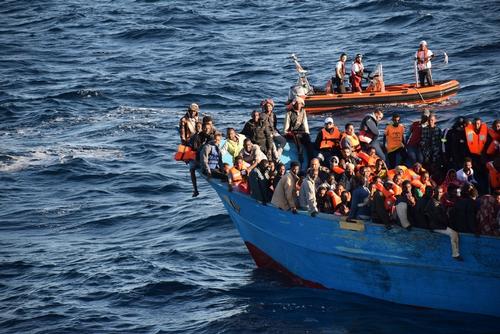 Bourbon Argos and Aquarius crew and Medecins Sans Frontieres (MSF) staff rescue 700 people aboard an overcrowded wooden boat in the Central Mediterranean Sea.
