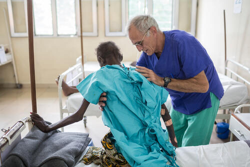 Kiné working with unrecognizable patient at CHK hospital in Kinshasa run by Médecins Sans Frontières (MSF).