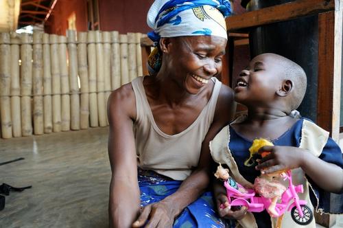 Martha Fulagbe (4) and her mother three days after the operation to remove an external fixator from Martha's badly broken leg. The high quality of surgery at Lubutu hospital meant that her leg could be mended correctly and it is only fractionally shorter that the other, rather than 5 or 6 inches as would probably have otherwise been the case. Her doll's leg keeps falling off, but she puts it back with a smile because she now knows that broken legs can be mended.  MSF took over the running of Lubutu General Reference Hospital in Maniema Province, DRC in 2006. The aims were to reduce the extremely high mortality levels in this remote rural area and to share with the Ministry of Health and other interested parties MSF's experiences of how best to reduce mortality in DRC when in full control of a hospital. The hospital is due to be handed back to the Ministry of Health in December 2011 after 5 years of MSF management. MSF's main findings over this period are that high quality secondary health services must go hand in hand with accessibility. High quality care requires properly salaried and regularly trained staff, a reliable supply of drugs and consumables, and a well-ordered patient circuit that is known to and understood by all staff. But if the population cannot access the care, it serves little purpose. Hence a schedule of weekly free referral services from the surrounding health centres, a 24/7 ambulance service for emergencies, and a network of radio comms between the health centres and the hospital are all essential. And if patients are desperately poor, they will not pay for health care, so for those who cannot pay, the costs must be borne by the hospital, not by the patient.