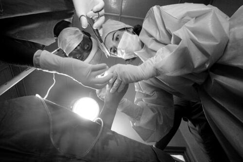 Sri Lanka, Mannar, 16-07-2007 Dr. Carolina Cardemil, an anaesthetist from Chile and Ana Medina, a nurse from Spain, take care of a woman who has tried to commit suicide by setting herself to blaze. This is a traditional way for Tamil women to end their lives.  <br/> In January 2007, MSF opened three surgical programs in Point Pedro, Vavuniya and Mannar, all in conflict-affected areas controlled by the government. The proximity to the frontline and restriction of movement make the inhabitants of these regions extremely vulnerable. MSF provides surgical support to the public hospitals, which mainly lack specialised staff. Since the beginning of 2007, teams have been performing an average of 450 surgeries per month.<br/> In May, MSF started a new programme in Batticaloa district in the east, where thousands of people have been displaced. The team organised mobile clinics offering primary healthcare to displaced people living in camps and supplies them with relief items and water. Gynaecological support is also provided to the Valachenai hospital.