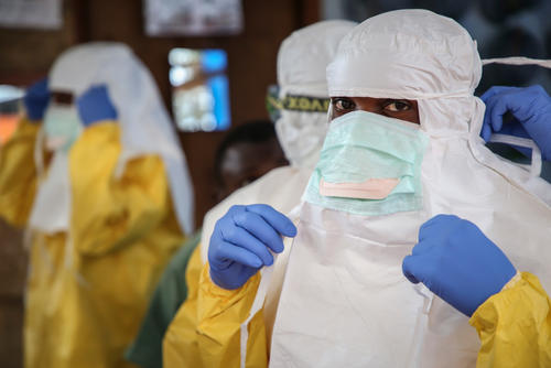 Images from the changing area in the ETC of Mangina. Health workers are preparing themselves and putting on the PPE outfit to enter the high risk zone of the centre. It’s very important to meticulously check the double layered outfit so no skin is exposed.