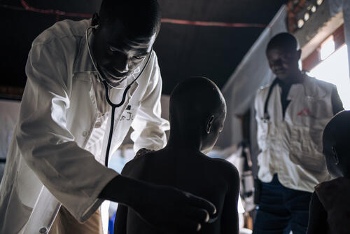 Dr. Justin Embani Drudra, treats Nyakuru Atsidri, nine years old, who suffers from measles in the measles unit run by MSF at Biringi Hospital, Ituri Province, northeastern Democratic Republic of Congo, on 07 November 2019. PHOTO: ALEXIS HUGUET/MSF