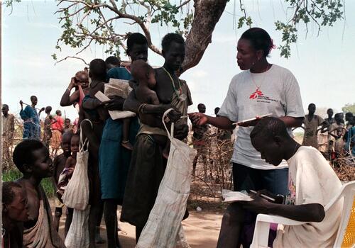 BAHR EL GHAZAL, SOUTH SUDAN, 05.1998. ***MSF INTERNAL USE ONLY*** MSF has been working for four years on and off, in these rebel held areas, serving a population of 150,000 people. Due to the continuing civil war and the blockade of the goverment in Khartoum, many refugees are left without food. Emergency aid is flown in but is not enough to help all people.  Photo by Samantha Bolton/MSF-H
malnutrition, conflicts, war, exhaustion, children, poverty, poor, feeding programme, drought, dry, desert, africa, fc, horizontal, national medical, doctor,staff, patient consultation, clinic, 
From the Illustrious database.