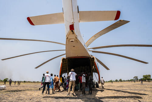 MSF staff offload non-food relief items transported by United Nations  Mi-26 helicopter in Chuil, Jonglei State, South Sudan, where displaced communities are receiving emergency assistance following recent violence.