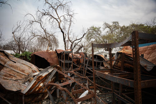 What remains of the pharmacy at Old Fangak now rusts away after it was destroyed in the 3 May 2025 bombardment.

On 3 May 2025, MSF hospital in Old Fangak, Jonglei State, was deliberately bombed by government forces, despite being clearly marked with MSF flags, and GPS coordinates shared with authorities. The attack began at around 4:30am, when two helicopter gunships first fired a missile on the pharmacy, burning it to the ground, before continuing firing on the town for the next 30 minutes. At approximately 7am, a drone bombed the Old Fangak market. At least seven people were killed, and 27 injured, including four MSF staff and two patients. 18 patients were receiving care during the time of attack.  Since late December 2025, at least 26 health facilities in Jonglei have reportedly been damaged or looted, alongside the seizure of humanitarian compounds and vehicles. 

This attack occurred in an increasingly volatile context, with rising tensions between government forces and opposition groups since late April 2025. Neighboring New Fangak fell under the government forces control, while the rest of Fangak County remained under opposition groups' control, creating a new frontline in Jonglei State.