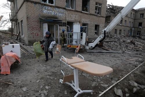 Employees of the State Emergency Service of Ukraine and medical staff evacuate medical equipment from a maternity hospital destroyed by a Russian missile attack in the town of Selydove, Donetsk region, amid the Russian invasion of Ukraine on February 16, 2024. (Photo by Anatolii STEPANOV / AFP) (Photo by ANATOLII STEPANOV/AFP via Getty Images)