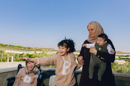 Rana Abu Hajleh with three of her children at their home in Azzun Atma, the occupied West Bank.  Rana says restrictions on movement have affected nearly every aspect of family life, from education to access to healthcare.
