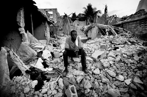 Nelvis Clerge sits on the remains of his house.The Clerge family use to live in a house in the area of Carrefour. They lived there with nine people: father Nelvis (55), his wife Elvire (45) and their seven children. Nelvis is a construction worker and build his house with his own hands in the last 25 years. The earthquake destroyed everything and took the life of their daughter Neemi (8). They live in a shack next to their house, with the children and the neighbors. Elvire got injured and is at the MSF hospital. They haven't received food or other help so far.